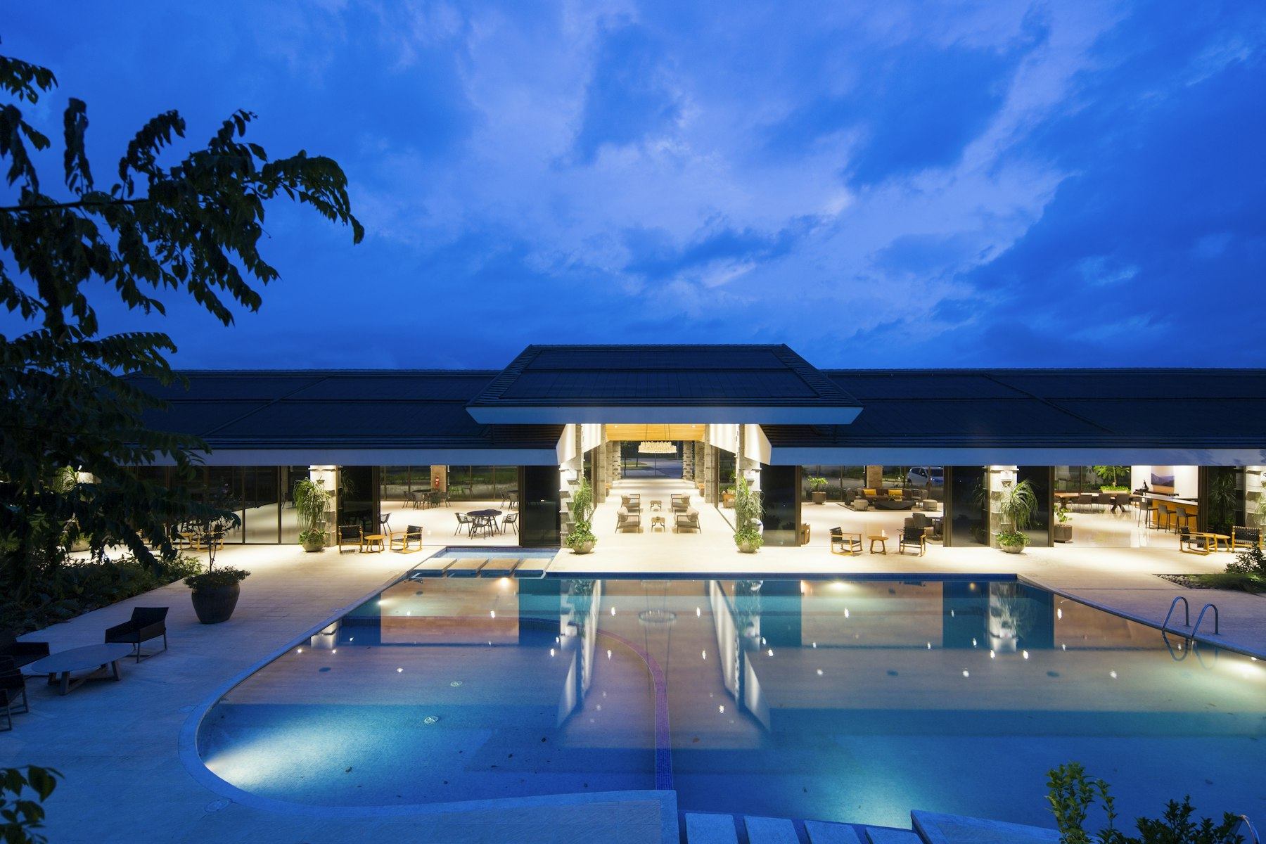 Luxury hotel pool and pavilion at dusk